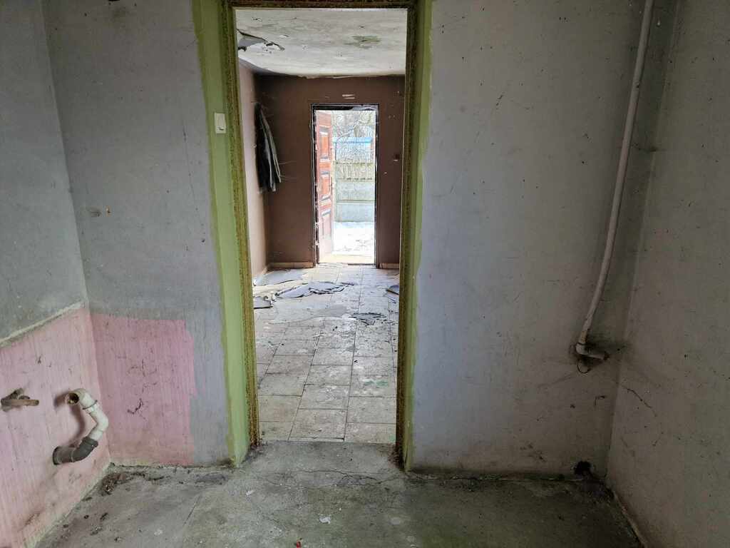 Ogrodzona działka z domem i garażem